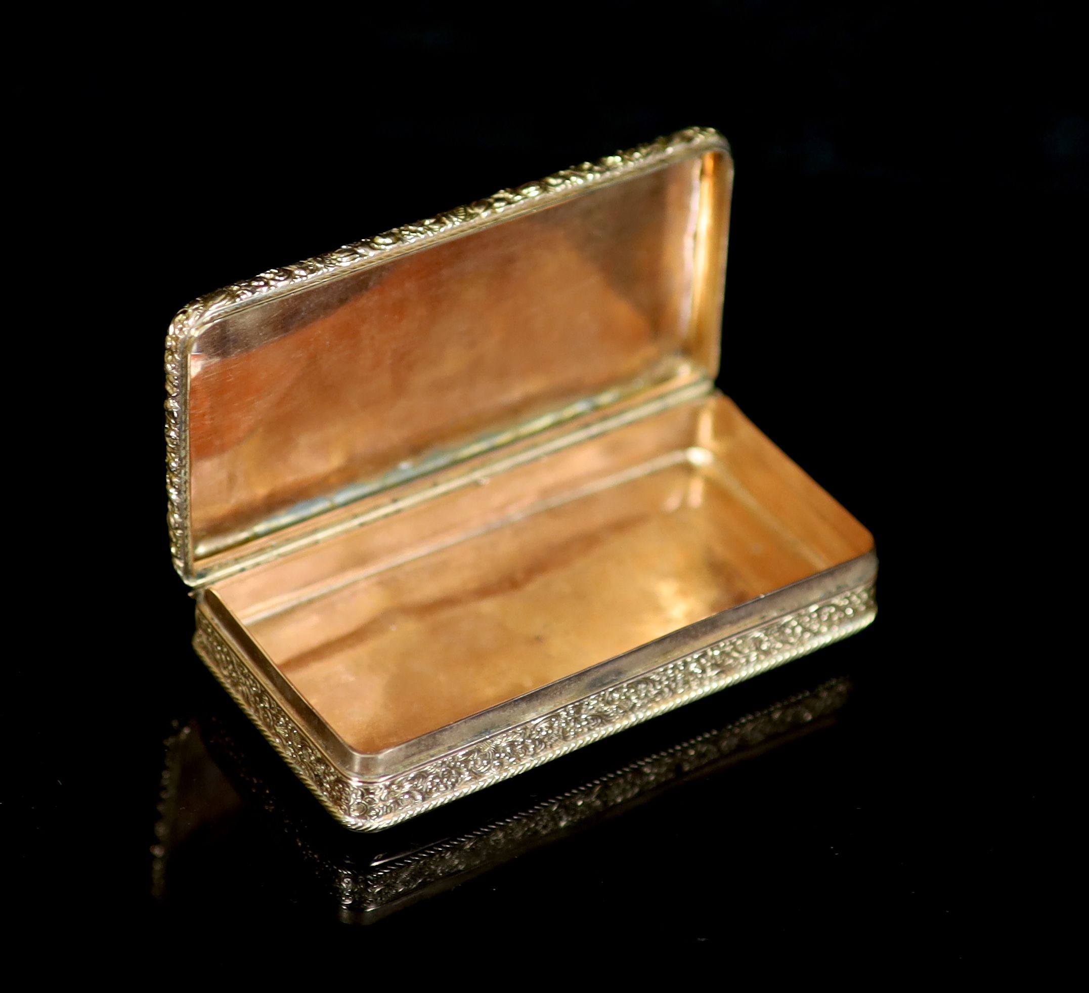 An early 19th century French engraved and engine turned gold rectangular snuff box, with hinged cover